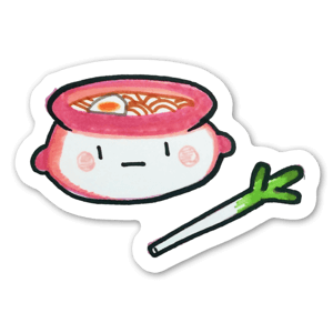 A yummy pot of boiling ramen with a leek.