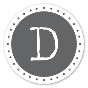 A sticker with the grey monogram 
