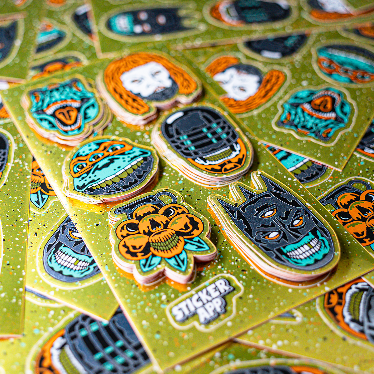 Golden custom sticker sheet and single die cut stickers, printed on glossy mirror, with designs showing monsters, dinosaurs, and aliens, with an orange back paper print.