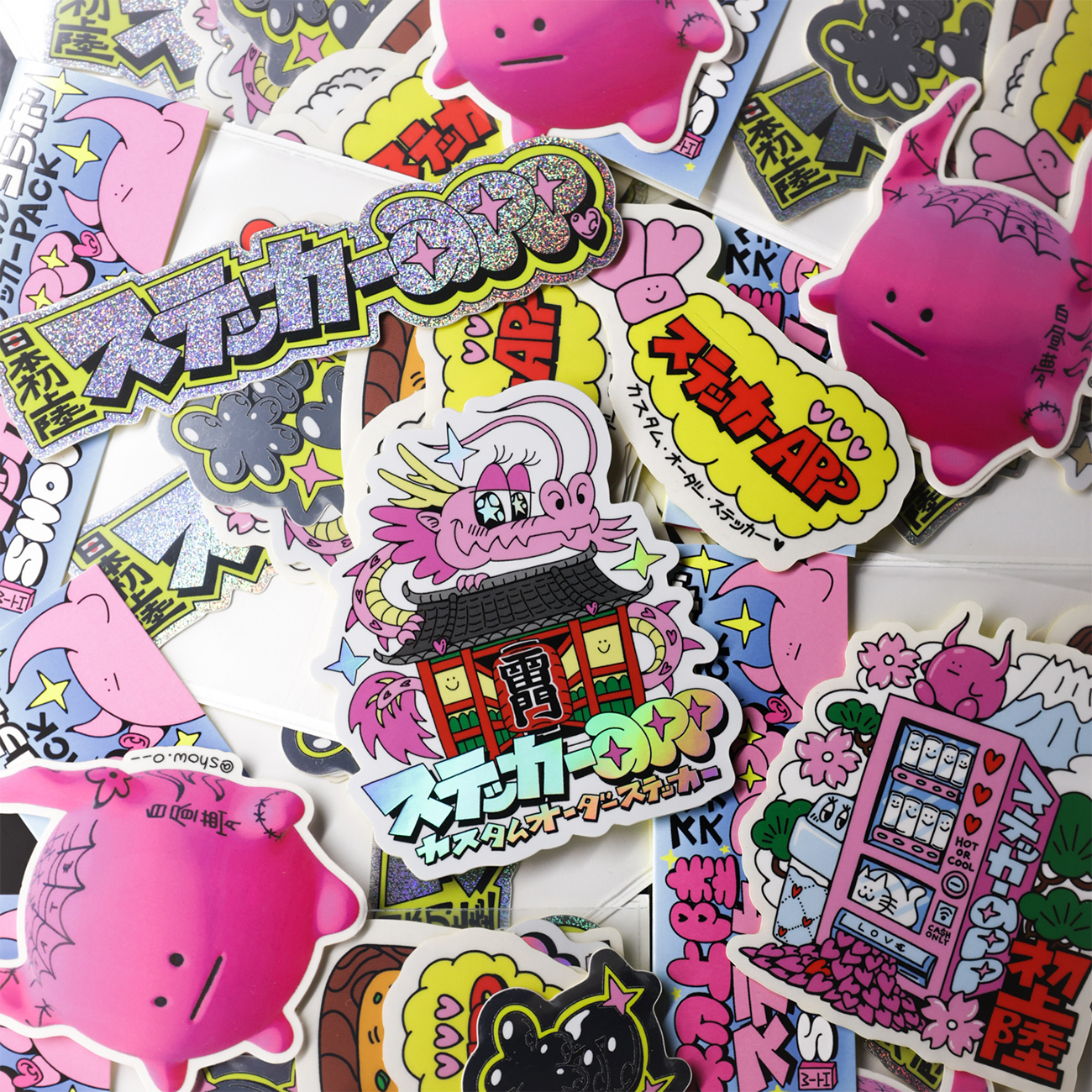 A collection of colorful Japanese pop art die-cut stickers featuring cute cartoon characters, bold text, and playful designs.