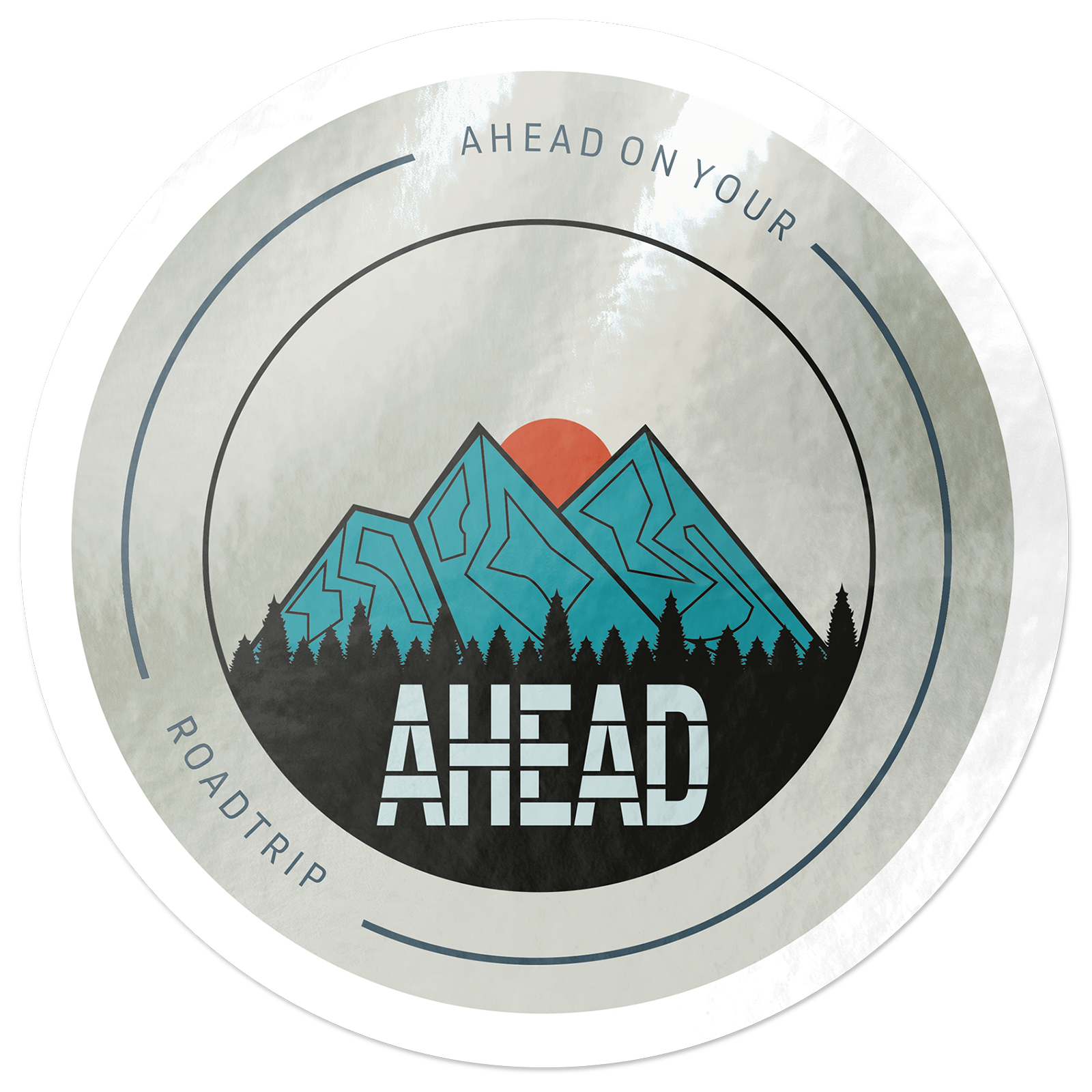 Circular sticker with mountains, a red sun, and trees. Text reads "AHEAD ON YOUR ROADTRIP" and "AHEAD" at the center. Printed on matte mirror.