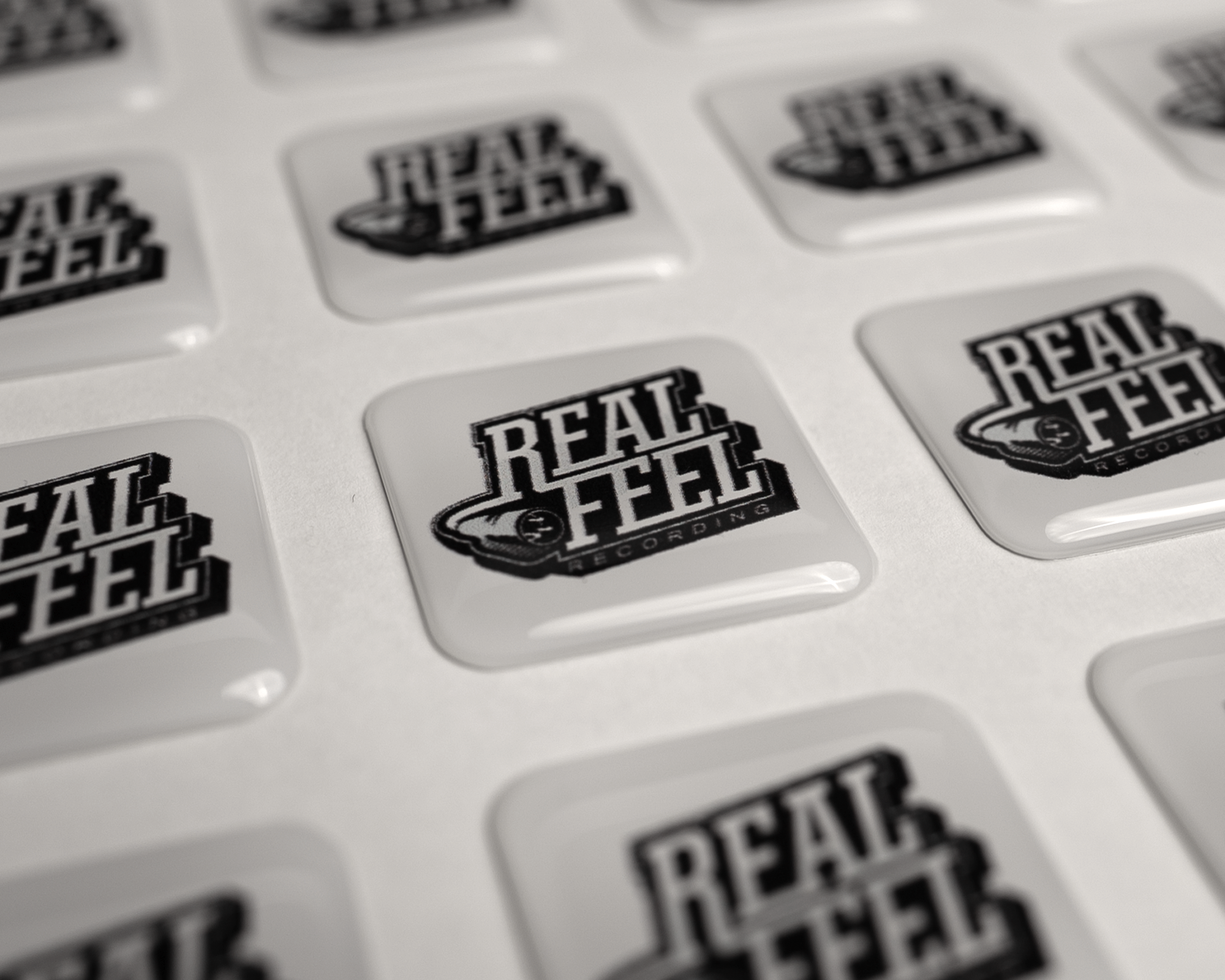 Epoxy stickers of Real Feel Recordings
