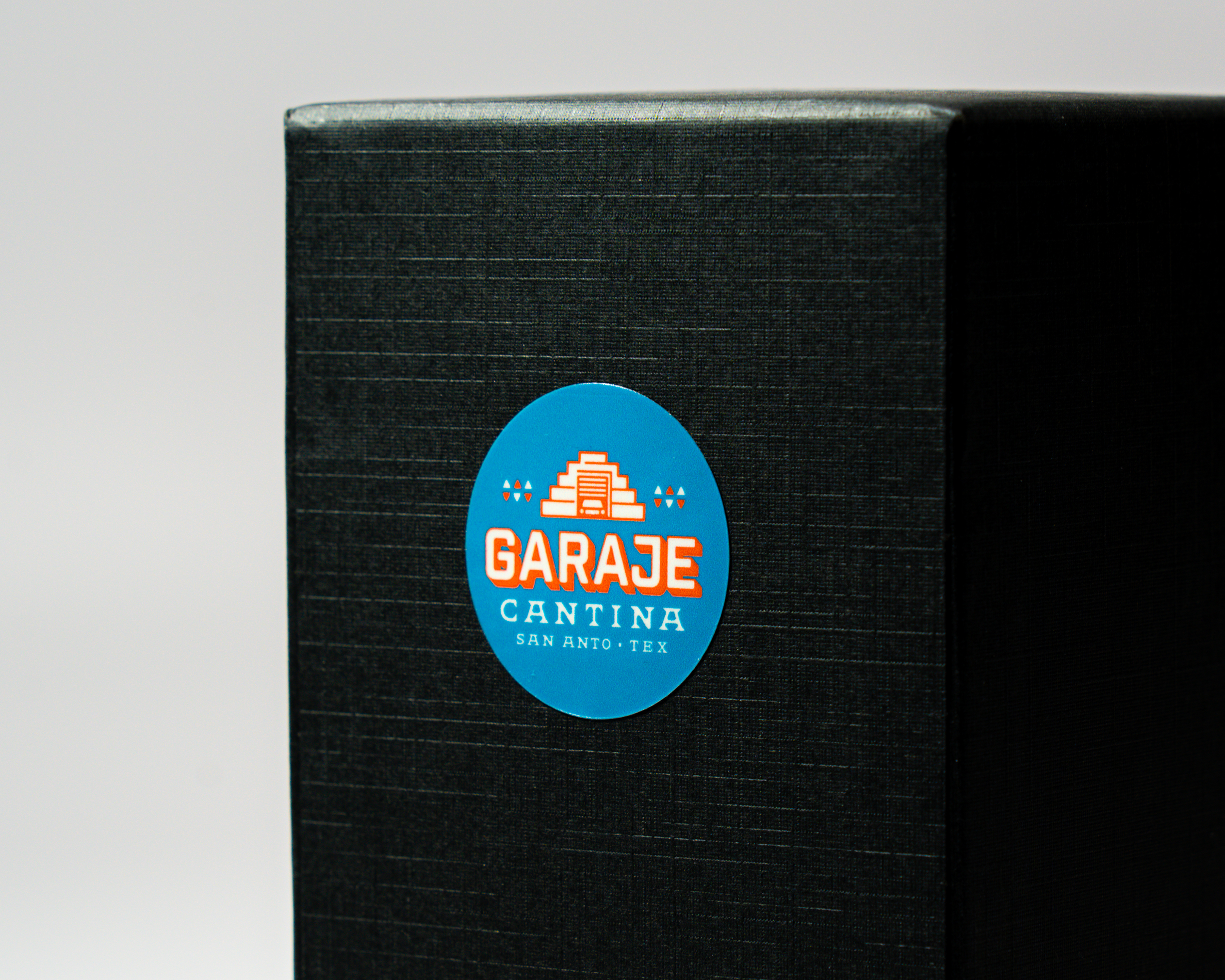 Blue stickers on sheet with Garaje Cantina morif