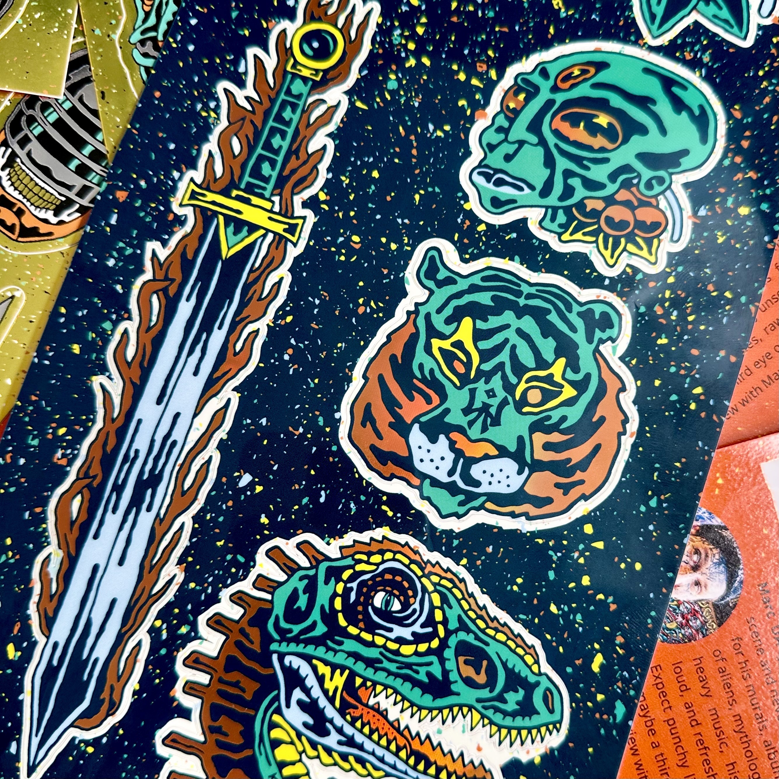 Colorful holographic sticker sheet featuring a sword, a tiger, a dinosaur, an alien, designed by Marc_ua