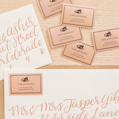 Elegant wedding invitations with cursive calligraphy, featuring RSVP sticker cards and envelopes labeled "The Joneses".