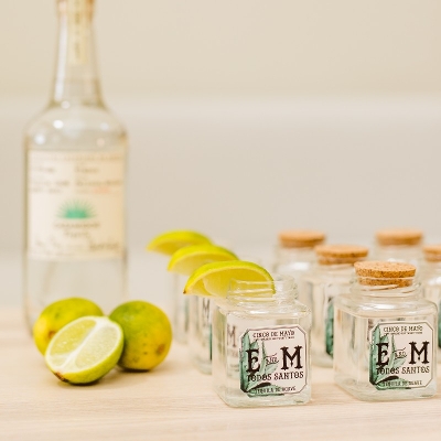 Monogram stickers on small tequila glasses.